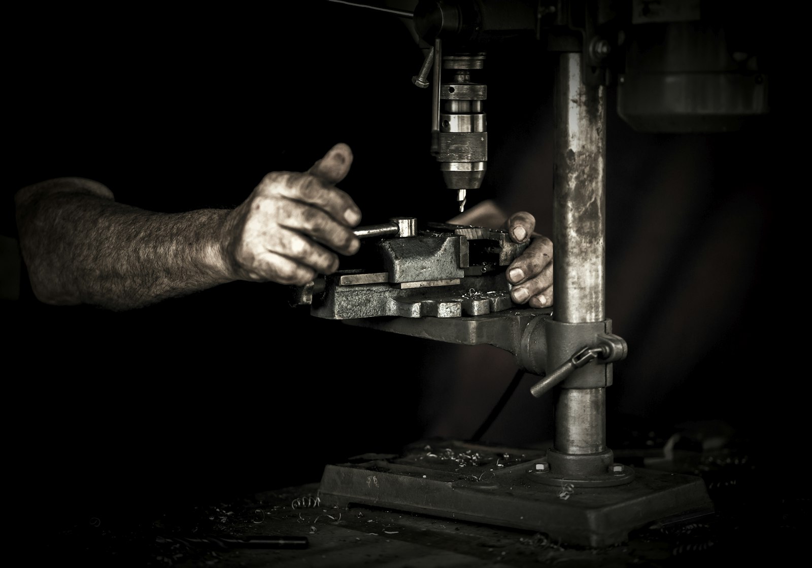 Sony a7R + ZEISS Batis 85mm F1.8 sample photo. Man using drill press photography