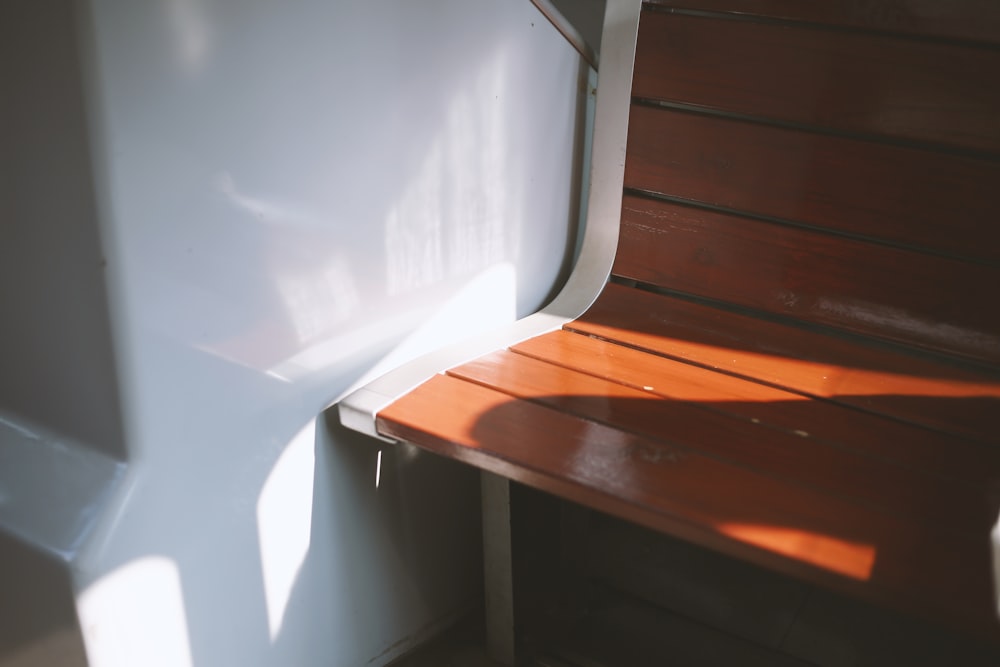 empty wooden chair near wall