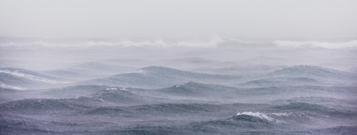 body of water under stratocumulus clouds