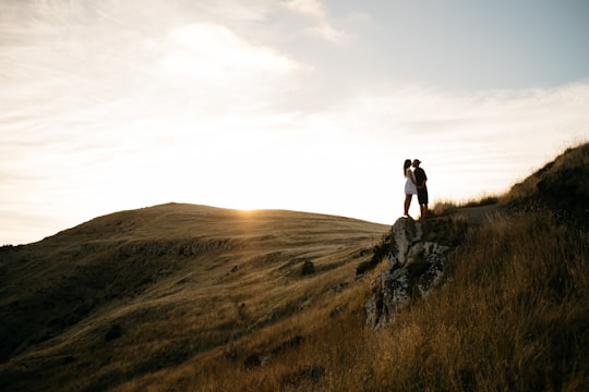 couple kissing on top of hill in Christchurch New Zealand