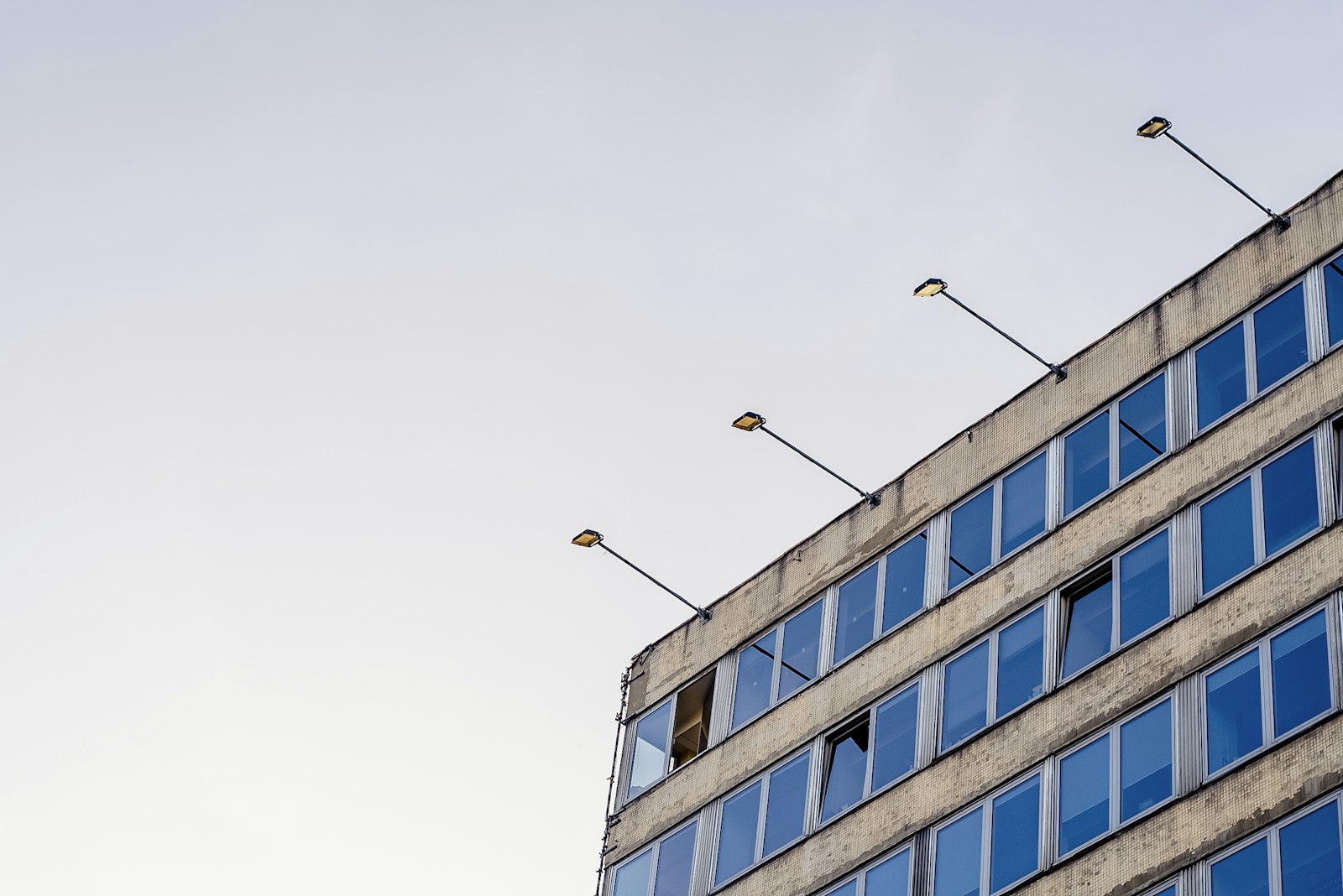 Sony a7S + Canon EF 50mm F1.8 STM sample photo. Gray concrete building with photography