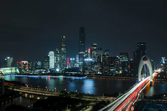 landscape photography of bridge near high-rise buildings