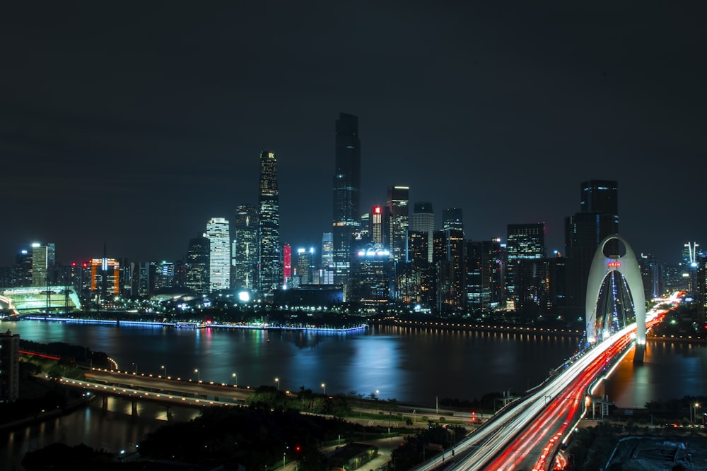 landscape photography of bridge near high-rise buildings