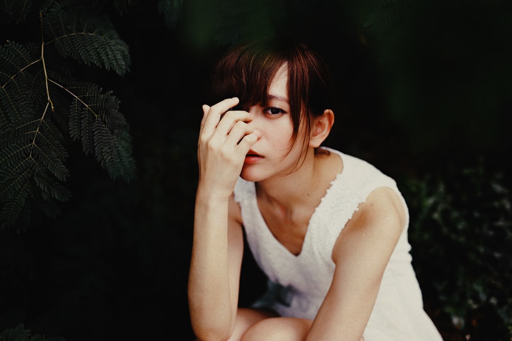 vignette photography of woman in white sleeveless dress