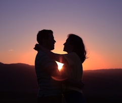 silhouette of hugging couple