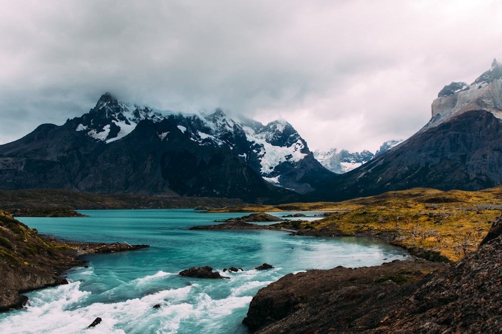 body of water surrounded by mountains