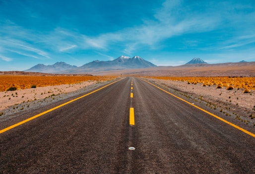 lone road going to mountains