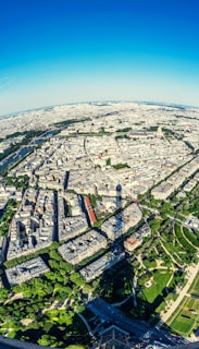 An aerial view of Paris with the airport in the distance.