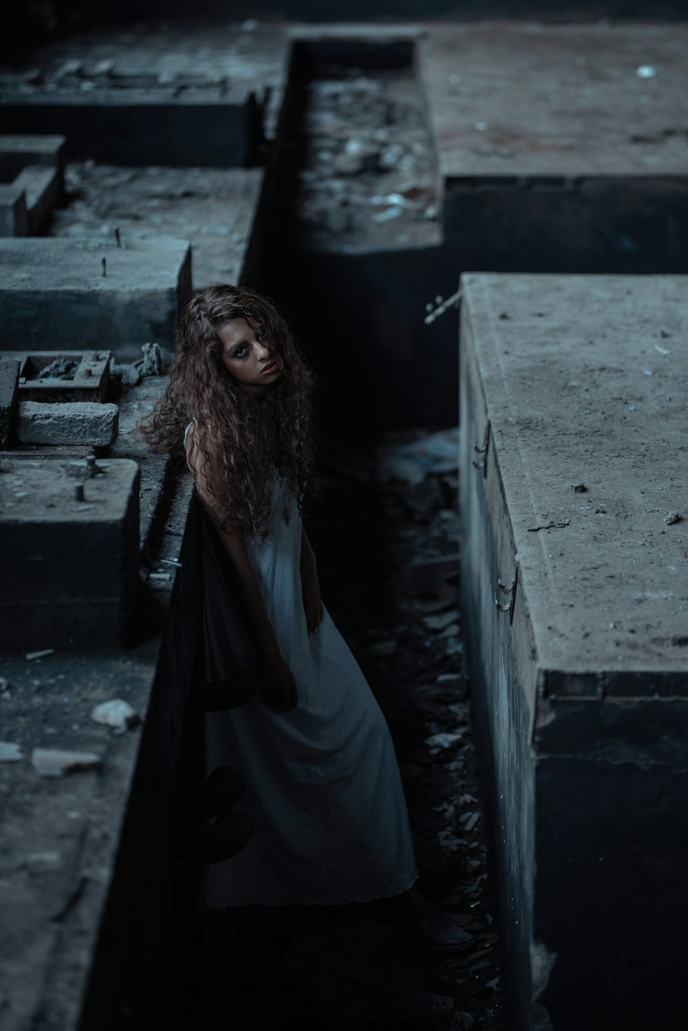 woman leaning on tombs