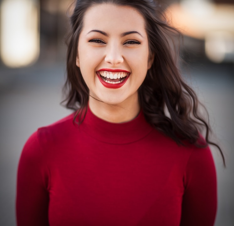 closeup photography of woman smiling
