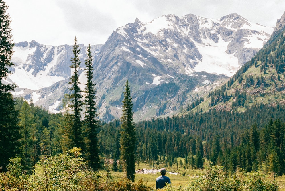 man standing near forest