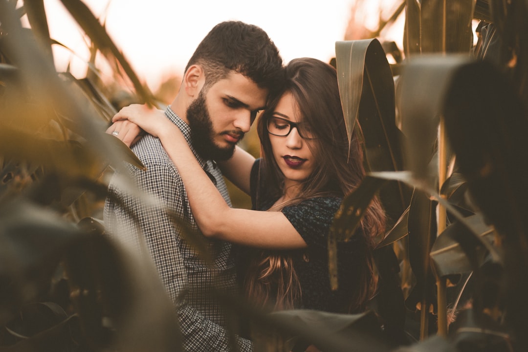 woman hugging man at the corn field