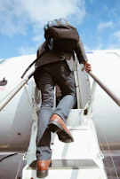 A business professional boarding an international flight, suitcase in hand, ready for new opportunities.