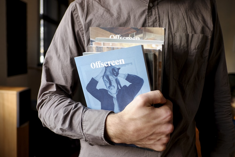 person holding books