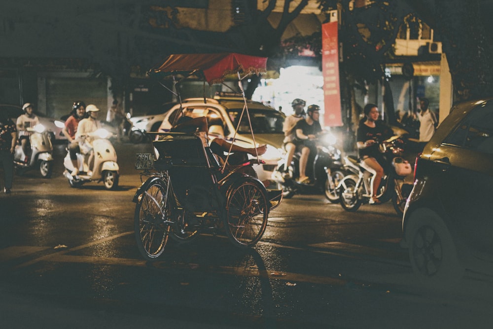 a group of people riding motorcycles down a street