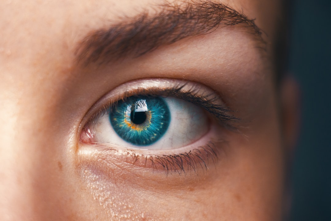  selective focus of blue eyed person washing machine