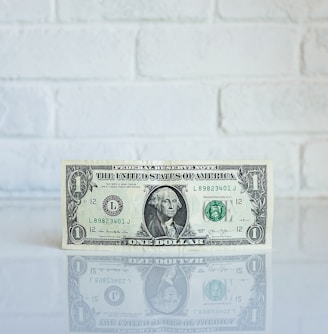 1 U.S. dollar banknote on white surface