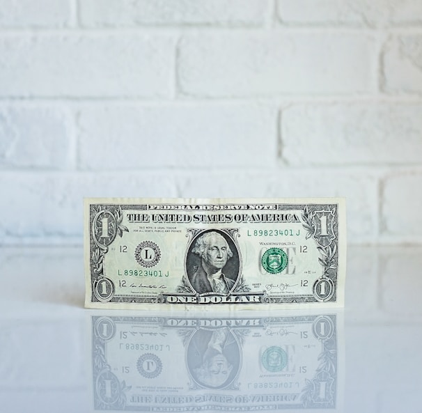 1 U.S. dollar banknote on white surface