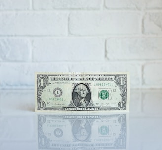 1 U.S. dollar banknote on white surface