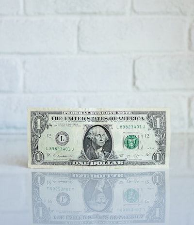 1 U.S. dollar banknote on white surface