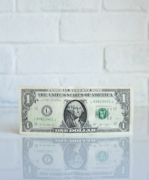 1 U.S. dollar banknote on white surface