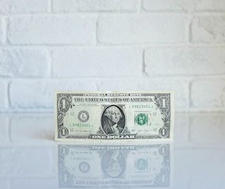 1 U.S. dollar banknote on white surface