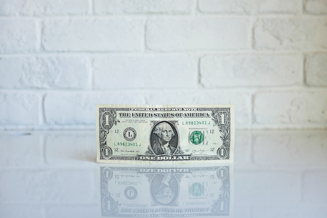 1 U.S. dollar banknote on white surface, One dollar bill by the wall