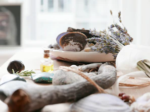 A collection of natural healing tools arranged on a wooden table.