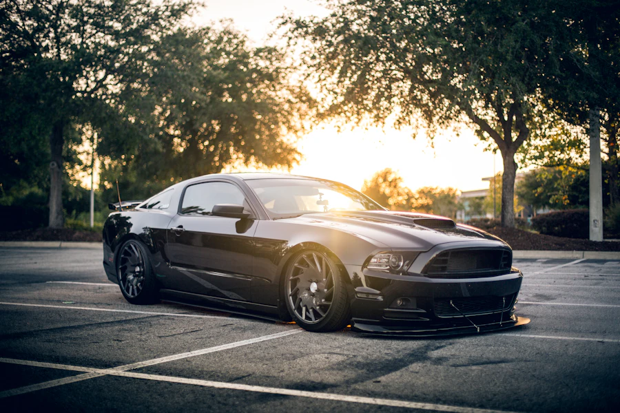 Black muscle car at sunset