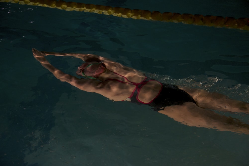 woman swimming on pool