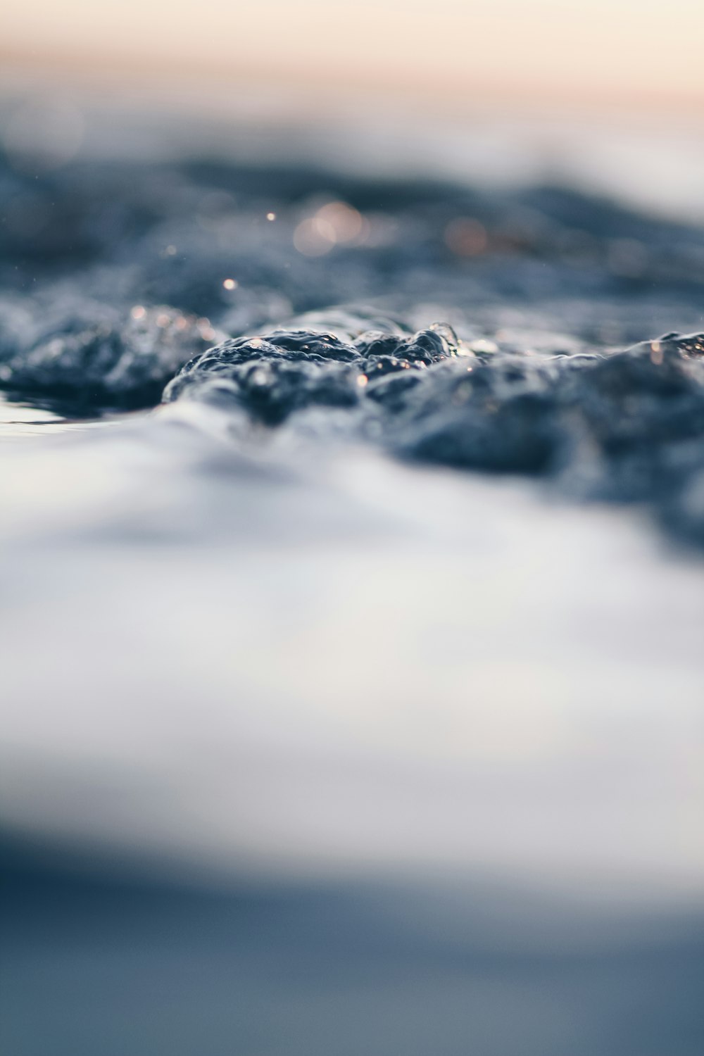 bokeh photography of body of water