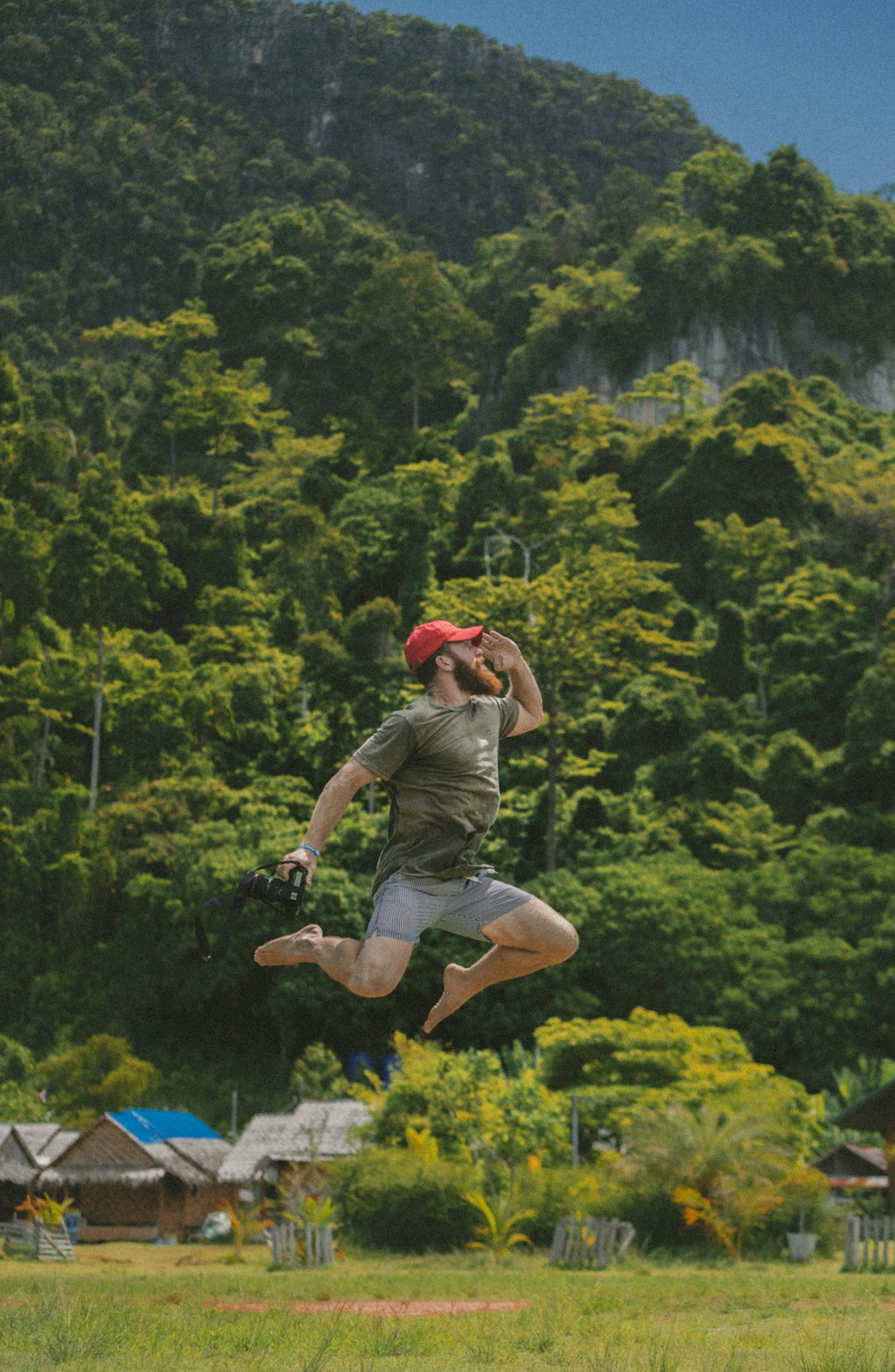 man in gray top jumping