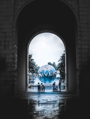 framing with frames for photo composition,how to photograph universe; people walking near universal themed park