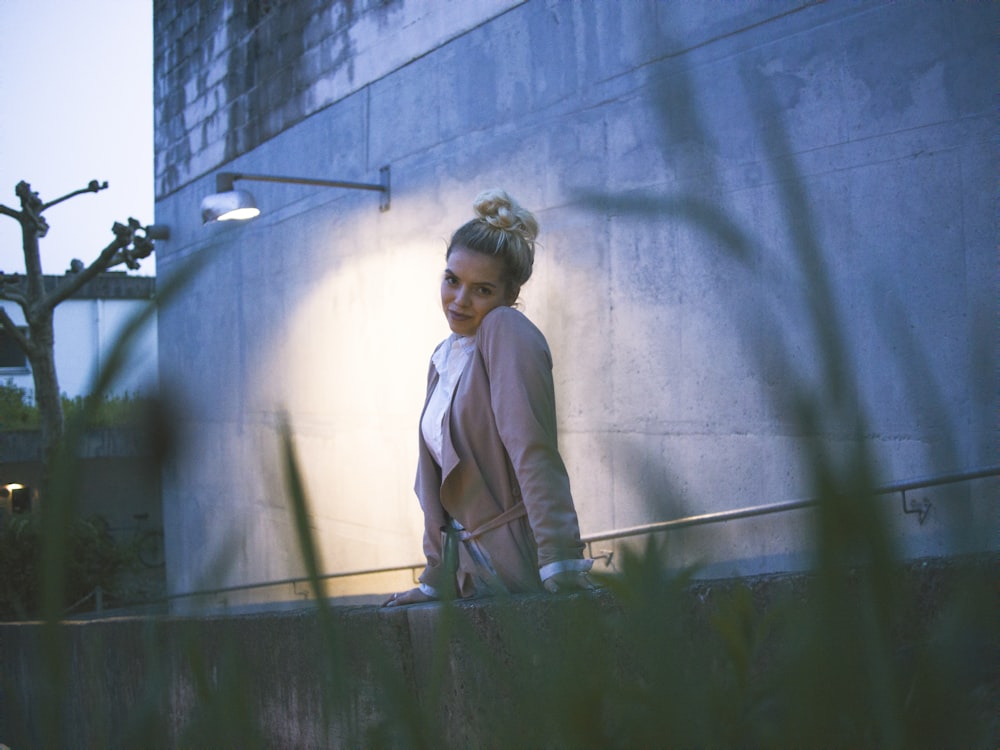 woman wearing beige coat