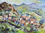 A vibrant, impressionistic painting showcasing a mountainous landscape with rolling hills in the background. The painting features rich and varied brushstrokes, blending colors together to create a sense of texture and depth. The foreground shows a cluster of what appears to be buildings or structures, painted in a mix of reds, blues, and whites. The background includes lush green hills and a partly cloudy sky.