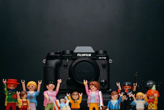 black Fujifilm camera body with minecraft toy lot