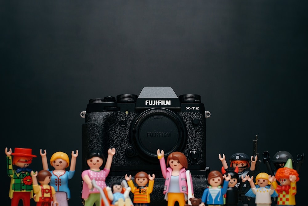 black Fujifilm camera body with minecraft toy lot