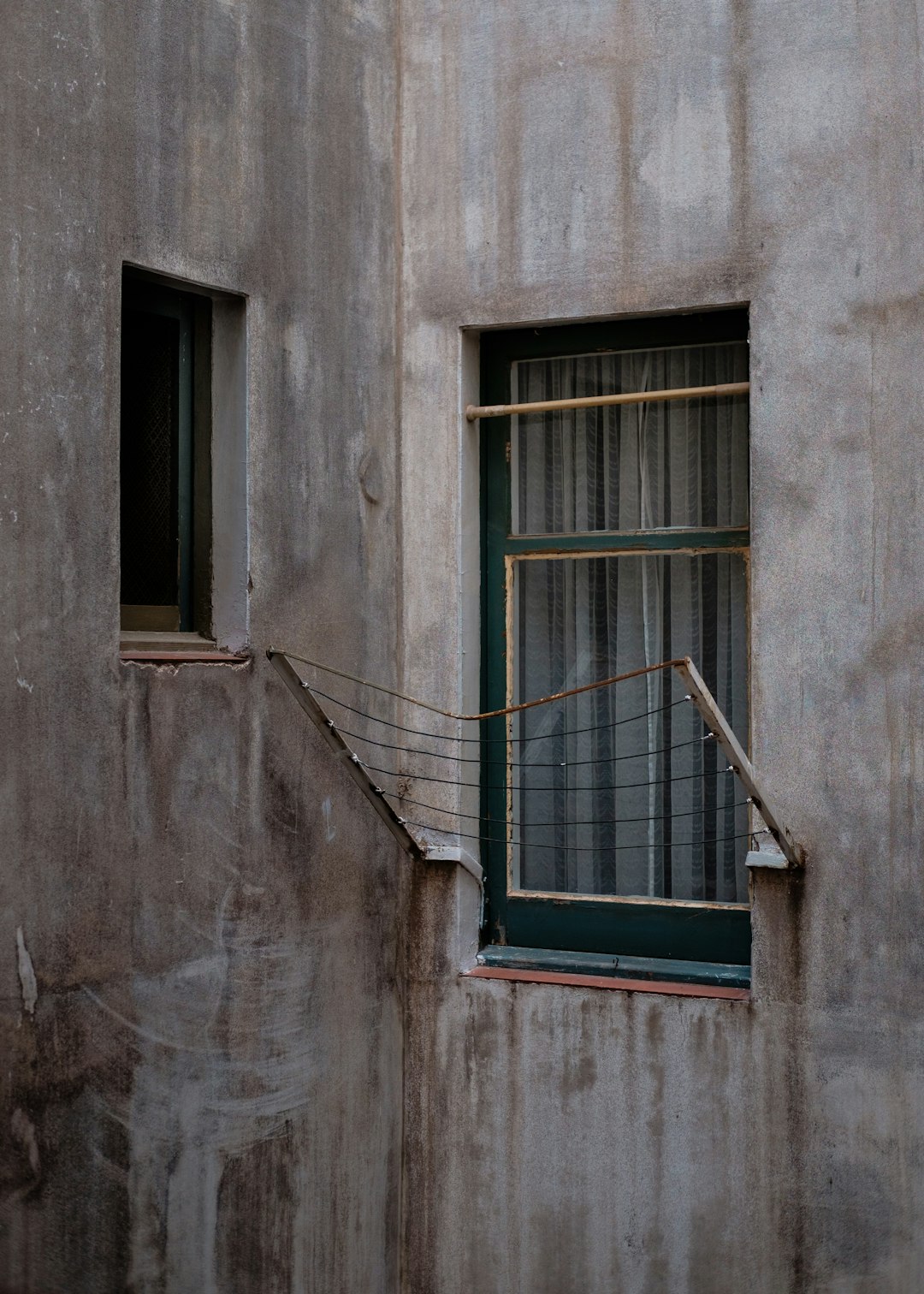 brown steel frames beside glass window