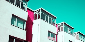 Modern residential buildings rising with fresh, clean lines and colorful accents.