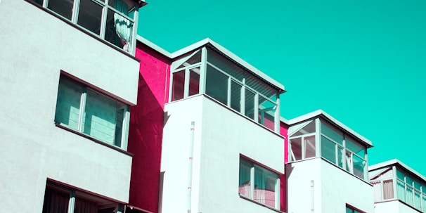 Modern residential buildings rising with fresh, clean lines and colorful accents.