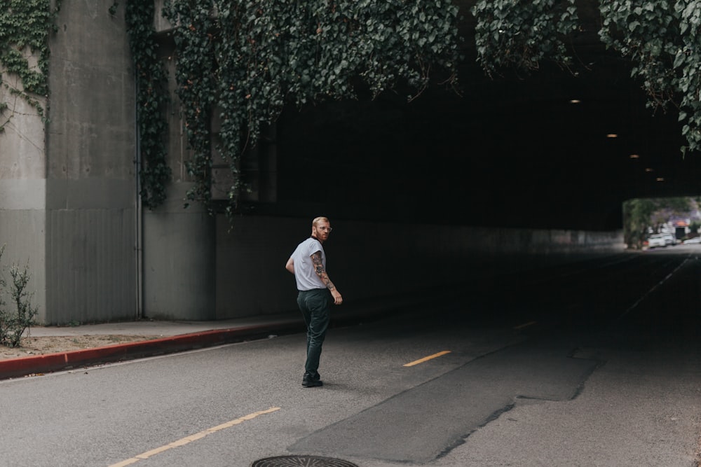 man walking through the tunnel