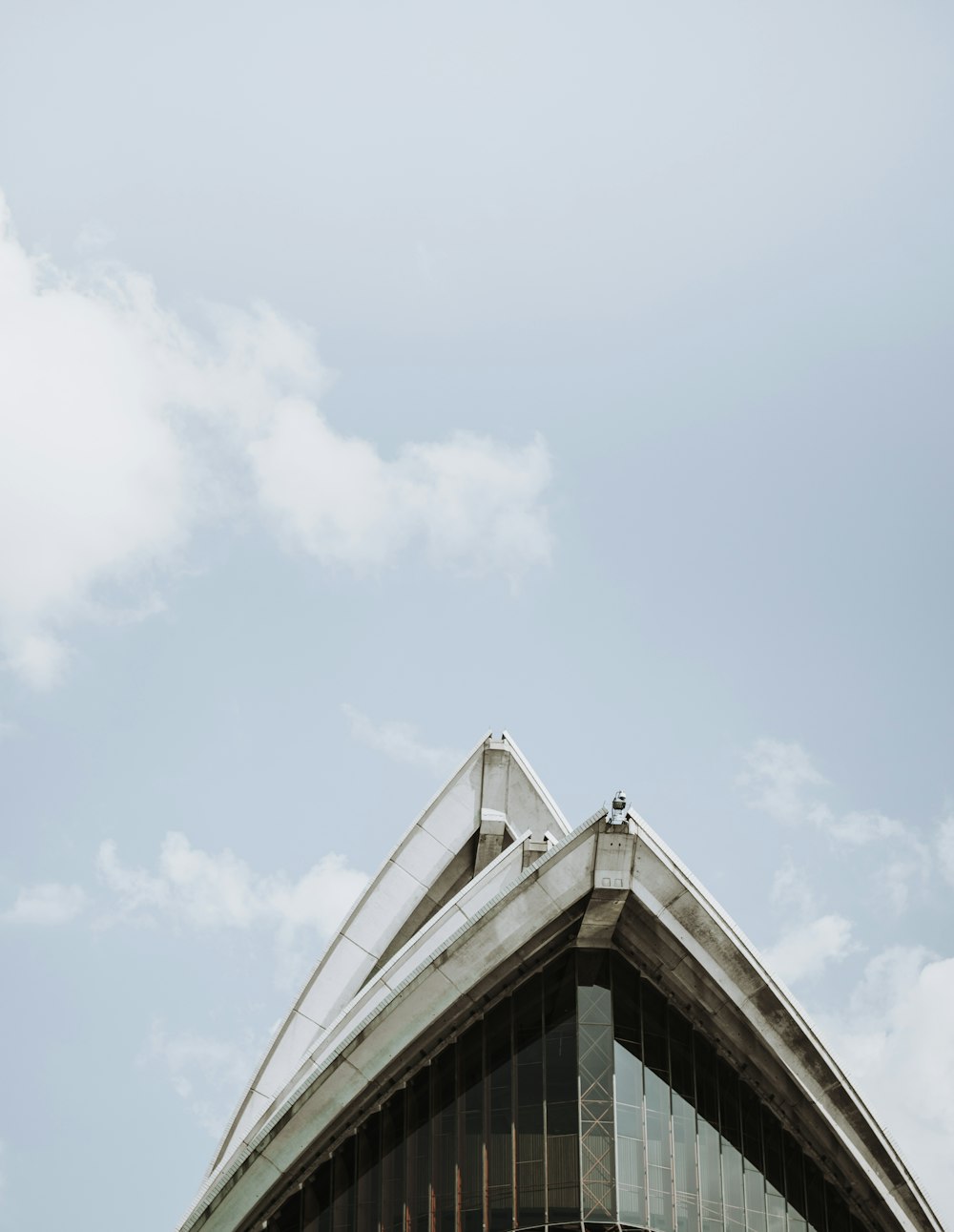 the top of a building with a sky background