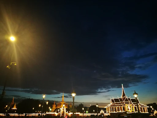 A sleek, illuminated city skyline at dusk showcasing modern architectural lighting.
