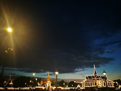 A cityscape at dusk with illuminated buildings connected by digital networks.