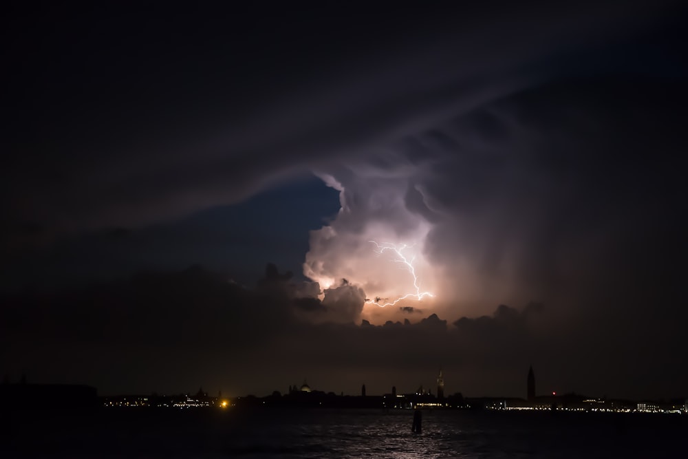 lightning above city at nighttime