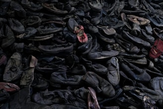 Stacks of sorted shoes ready for redistribution in a warehouse.