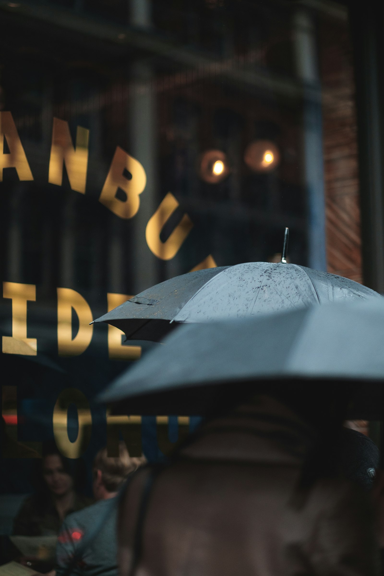 Fujifilm X-Pro2 + Fujifilm XF 56mm F1.2 R sample photo. Man on blue umbrella photography