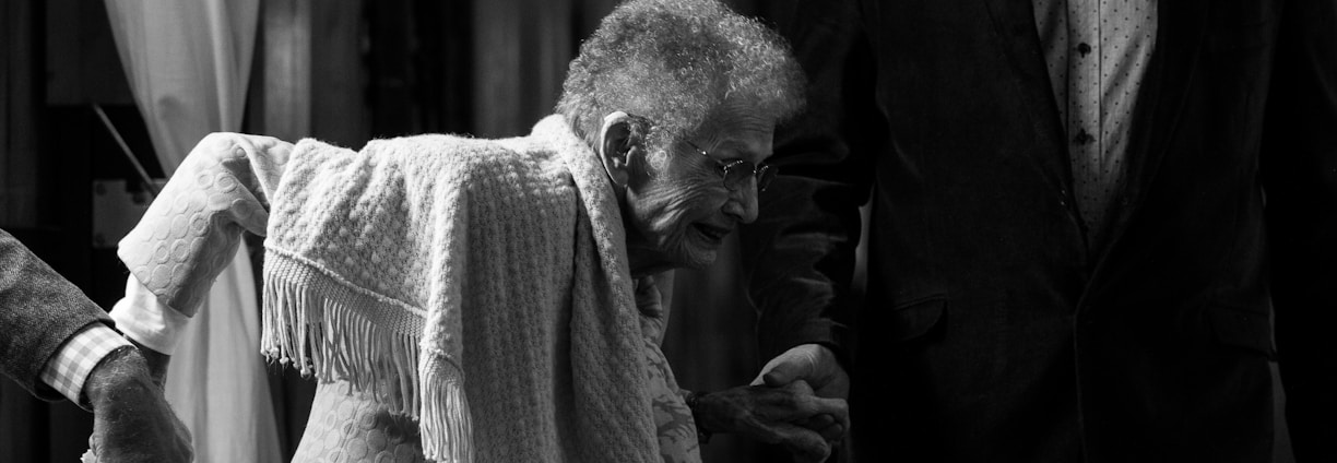 grayscale photo of woman with scarf