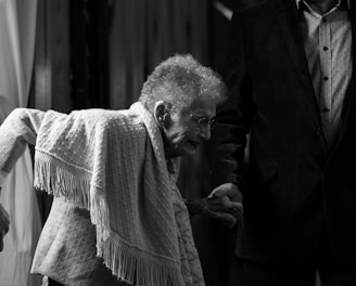 grayscale photo of woman with scarf