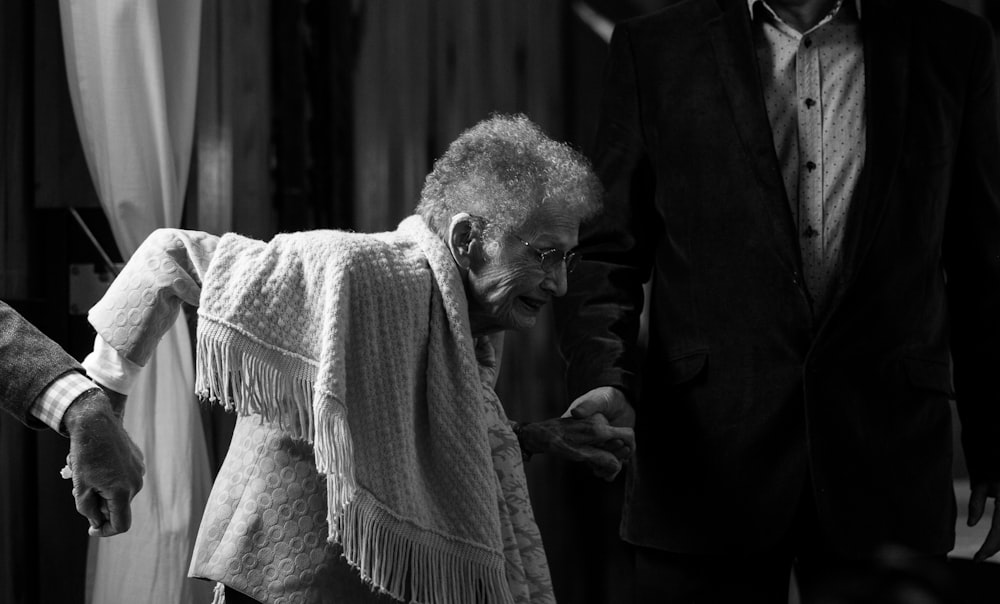 grayscale photo of woman with scarf